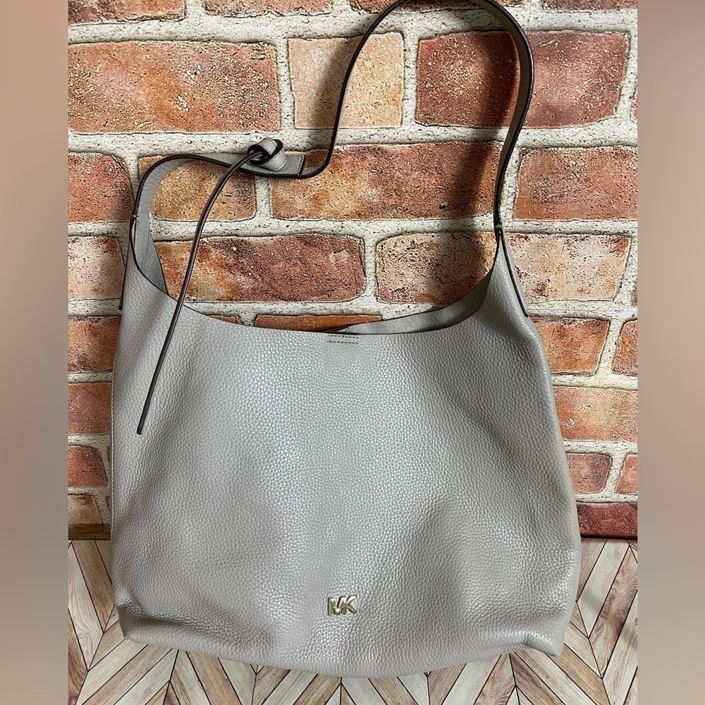 Michael Kors Bag with unique knot style strap. Super light bag!